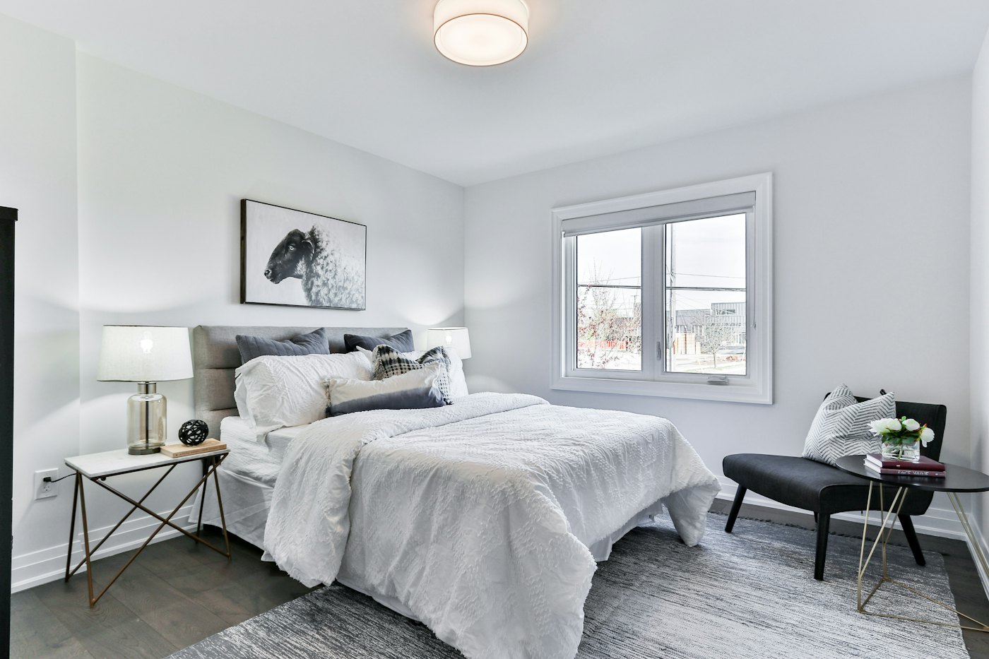 A made bed in a bright bedroom