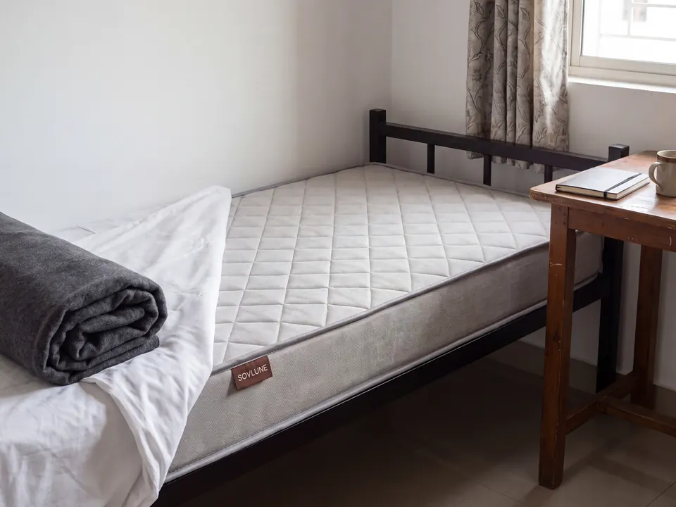 Sovlune Essential Firm foam mattress on a bed in a bedroom