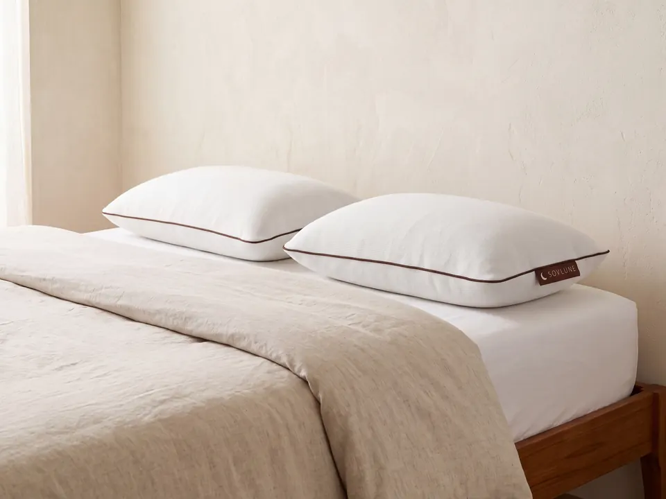 Sovlune Neck Support Memory Foam Pillows on a made bed